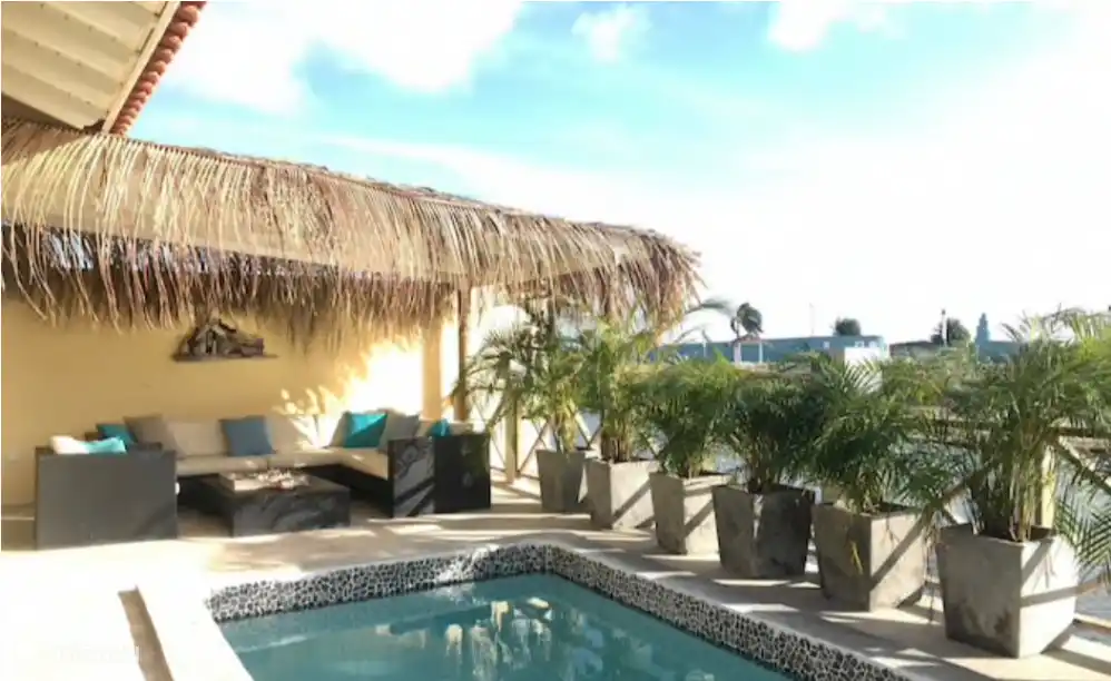 Private swimming pool and lounge corner.