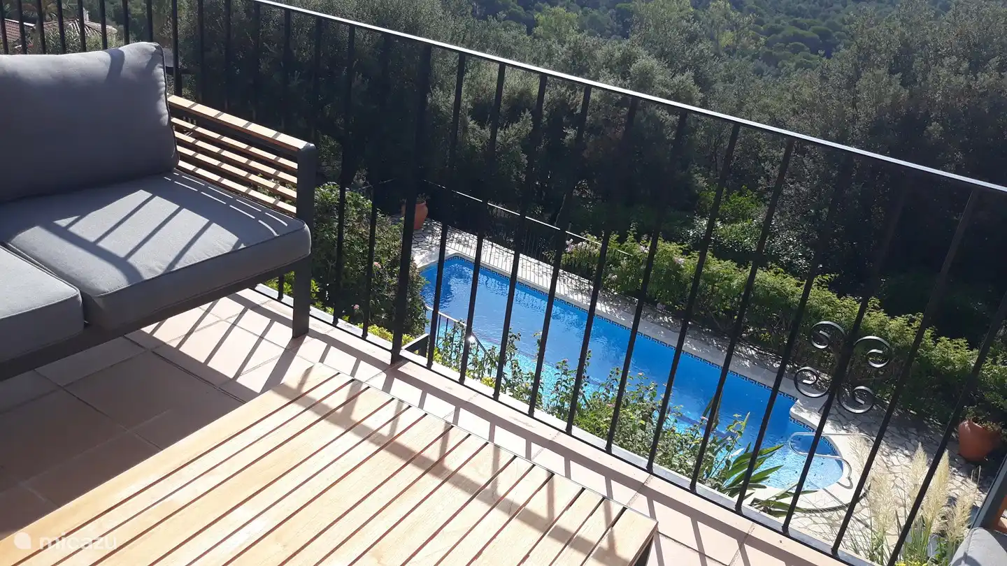 View from the balcony terrace on the pool and the hills of Gavarres