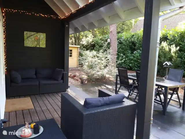 el tucan en Países Bajos, Güeldres, Emst (Epe) - casa vacacional La veranda de la casa natural De Toekan en Emst en el parque forestal De Vliegden