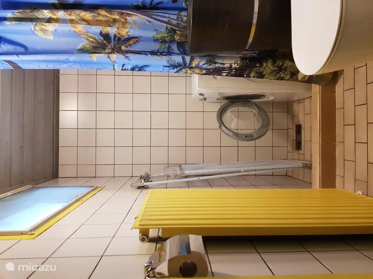 A washing machine has now been installed in the old shower area. The designer sink and toilet are also in this room.
