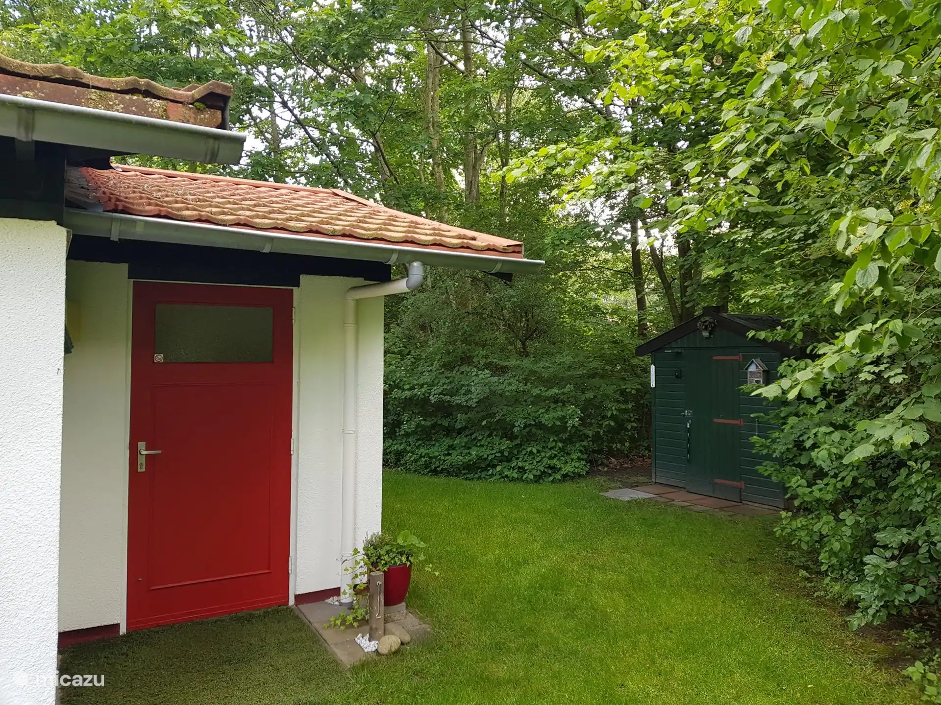 Behind the house is the shed, which also contains electricity and various play materials