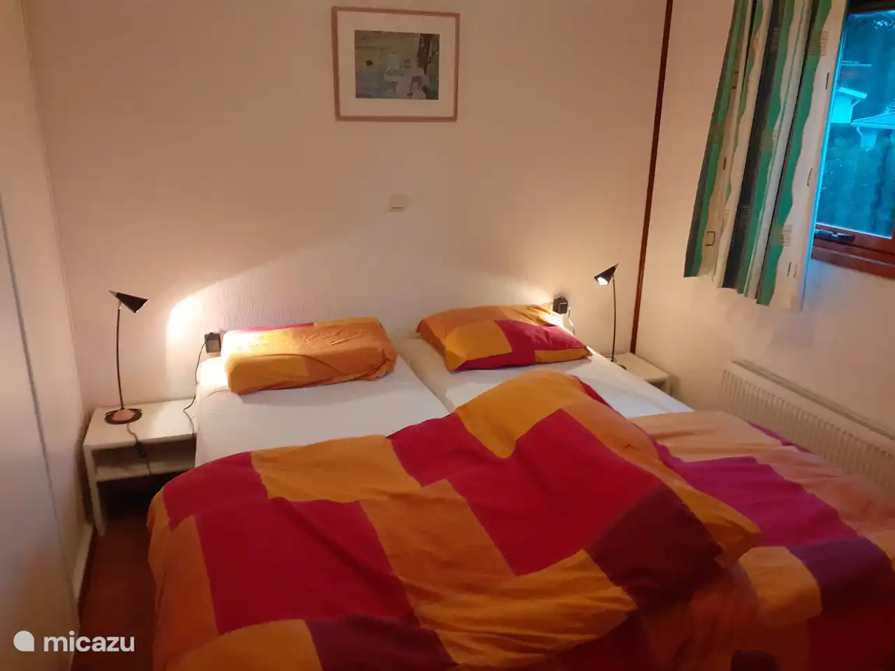 The spacious bedroom with good quality box spring beds.