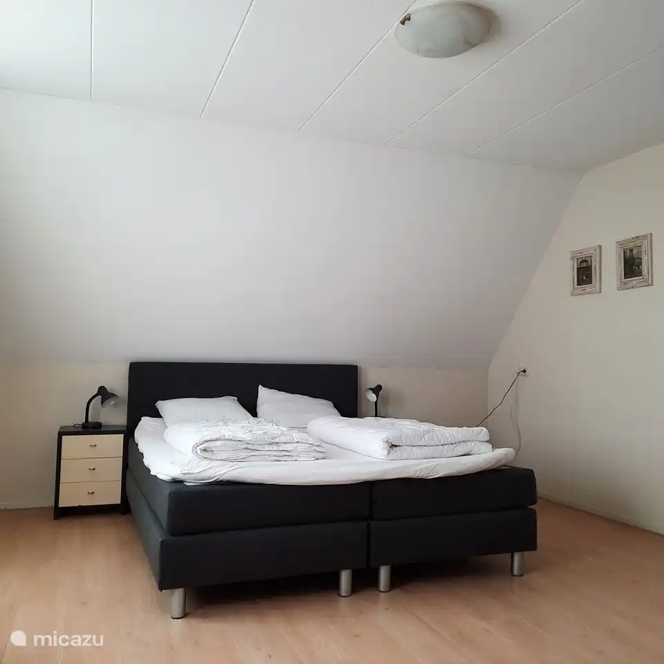 Spacious bedroom on the first floor with a double box spring