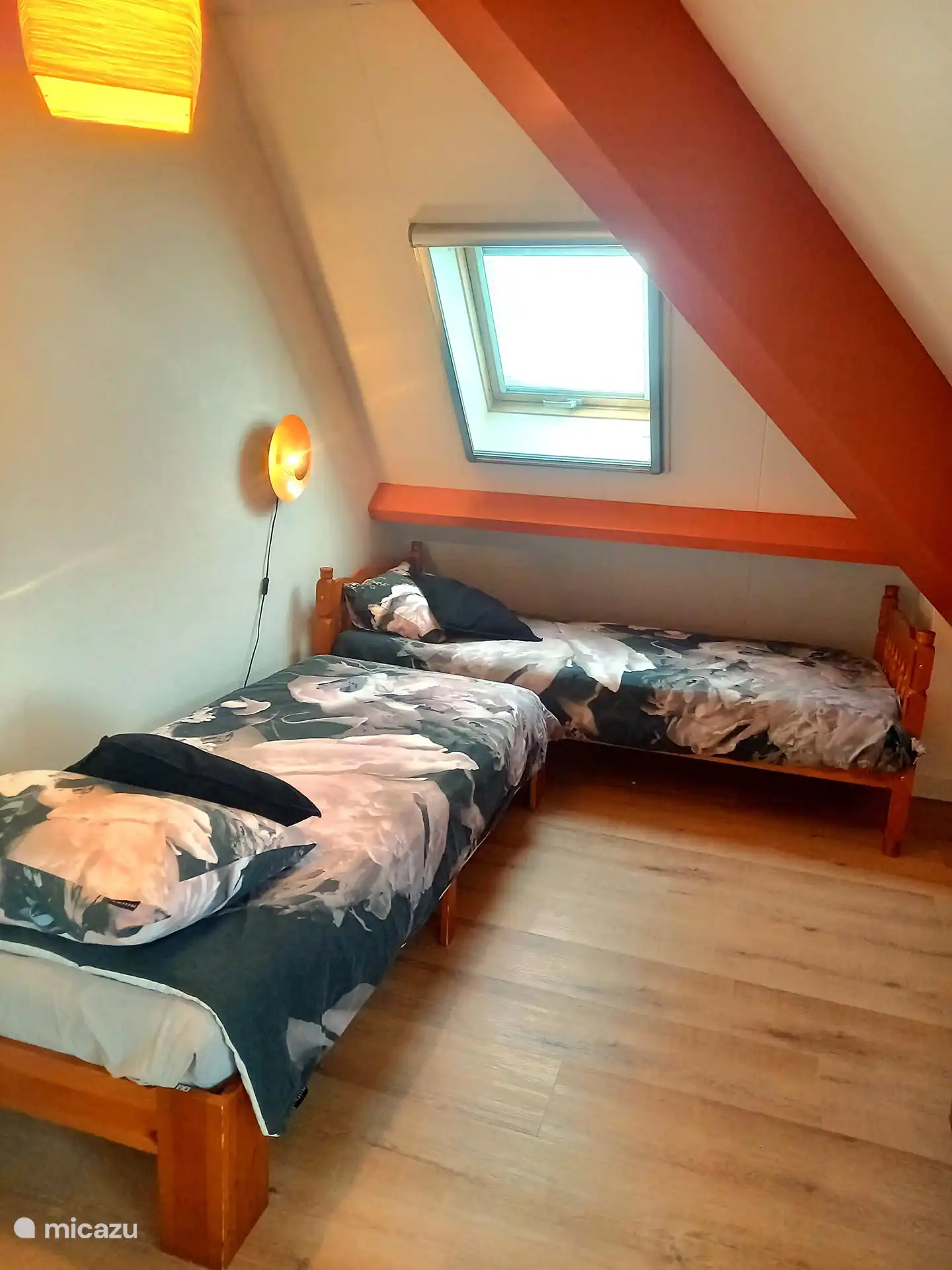 2 single beds in the orange room