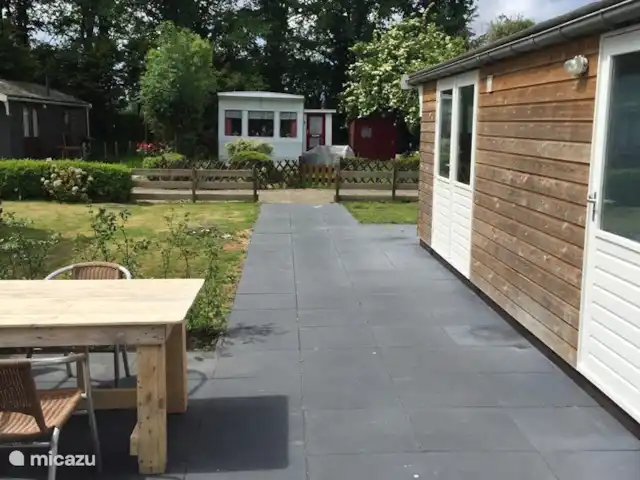 Pequeña casa Bergen NH en Países Bajos, Holanda del Norte, Warmenhuizen - chalet El jardín alrededor del chalet.