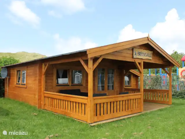 Boerenzwaluw huren in Nederland, Noord-Holland, Julianadorp aan Zee - blokhut / lodge buiten/zij aanzicht