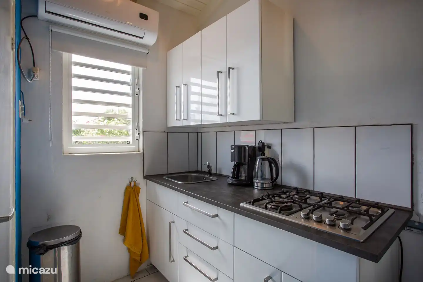 the kitchen is small but complete and new