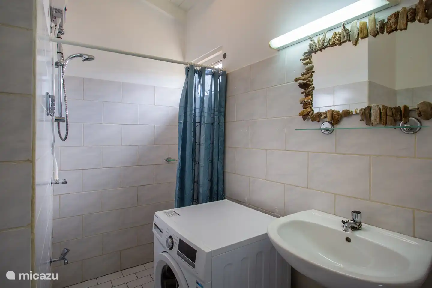 the bathroom is nothing special but a hot shower and a new washing machine