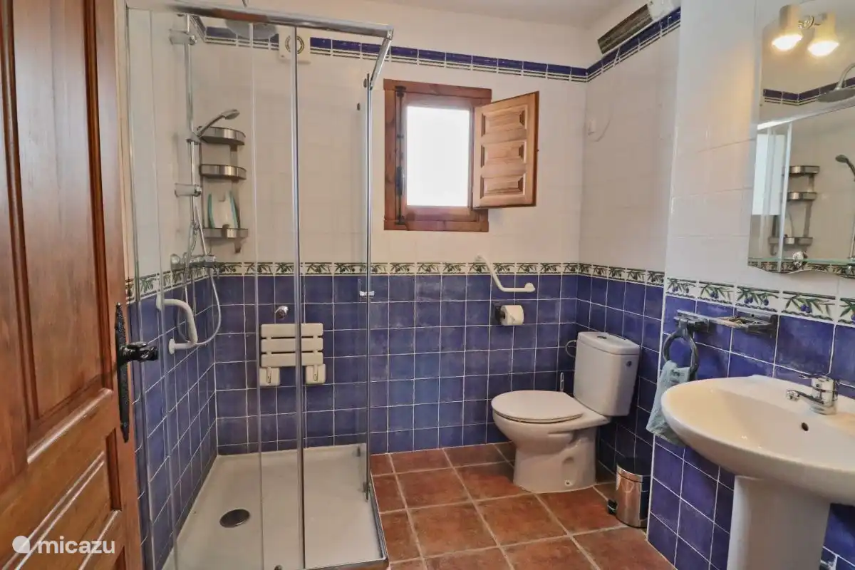 The bathroom with shower, toilet and sink