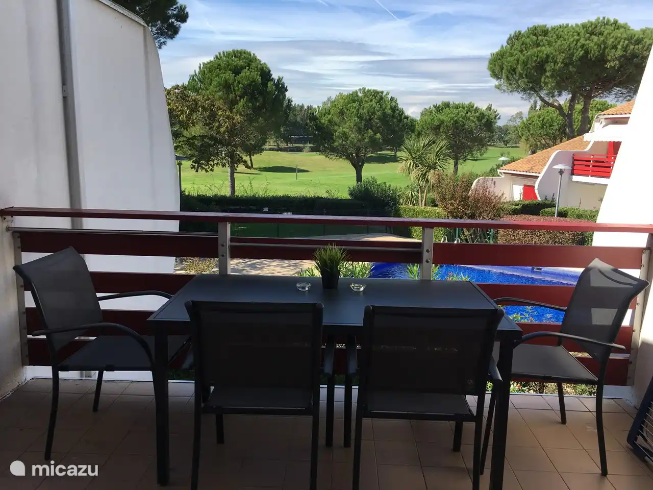 view from terrace on swimming pool and golf