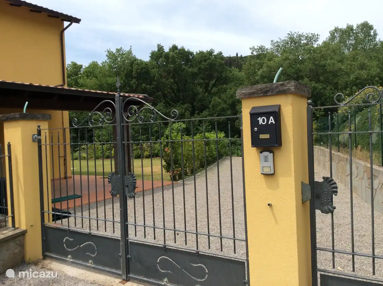 Entrance with gate and spacious parking lot