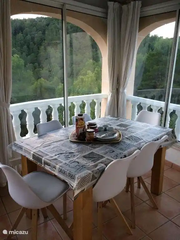 Veranda overlooking the pool and forest. Spot birds of prey while having breakfast.