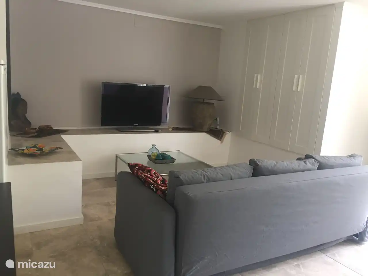 Lots of storage in cupboard wall 