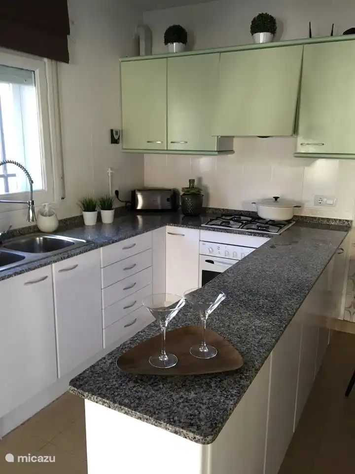 Kitchen with gas fire, oven, micro, refrigerator and all accessories.