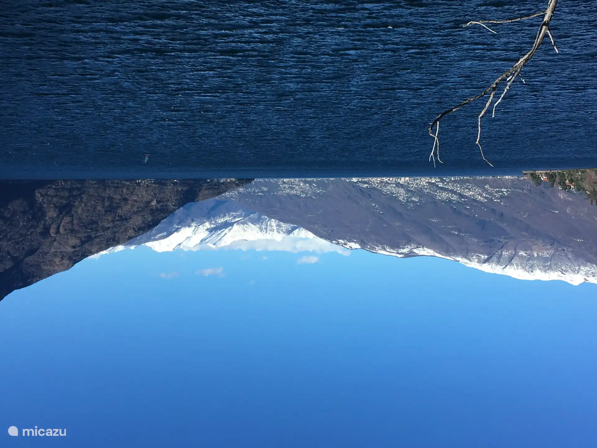 View to the north with the snow-capped peaks above Carmine Superiore, Locarno and Switzerland in the distance including San Bernadino