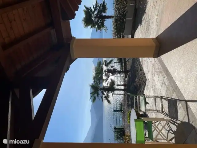 If the sun is too bright, you can sit under the parasol or on the veranda