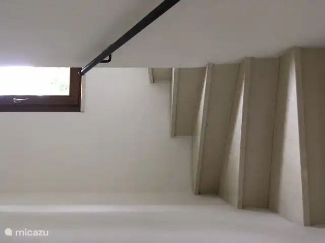 through a bend you enter the hallway to the bathroom and bedroom.