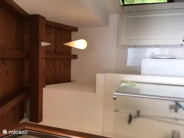 The beautiful wooden beamed ceiling in the bathroom