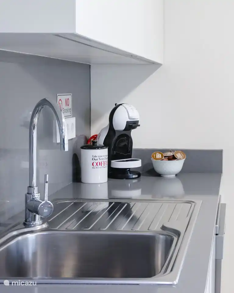 The kitchen has a Dolce Gusto coffee machine.