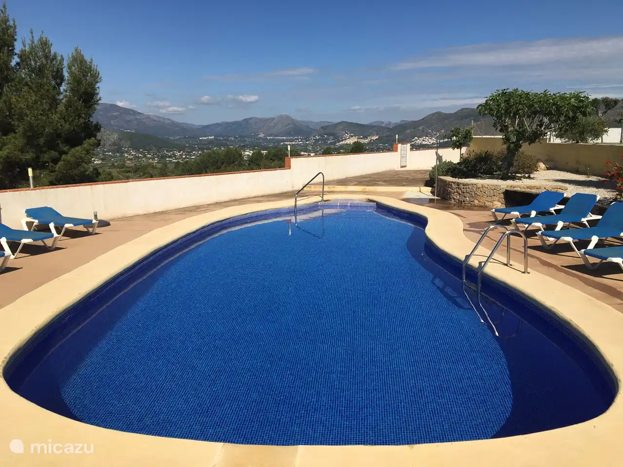 Large swimming pool with stunning views over the Pop Valley