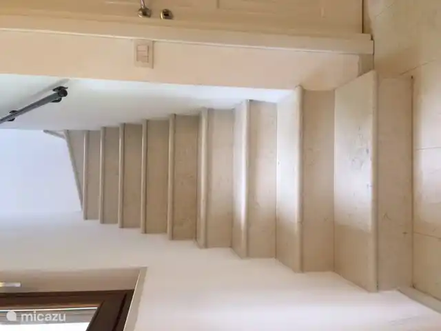 From the hall a staircase leads to the 1st floor. Stairs and floors on the BG are made of marble.