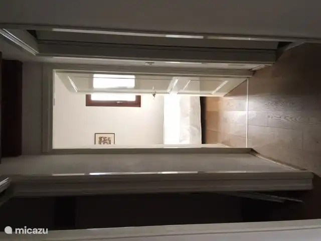 Upstairs through the hallway you enter the bedroom