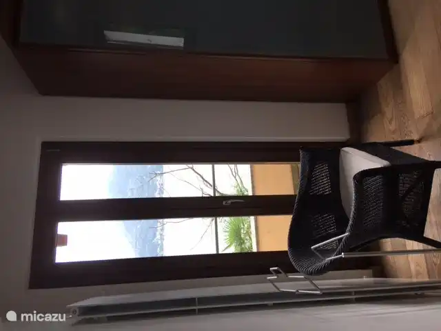 In the bedroom on the left is a balcony with a view of Lake Maggiore.