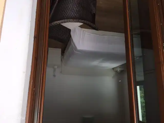 From the balcony you look straight into the bedroom with 2 mattresses of 90 x 200.