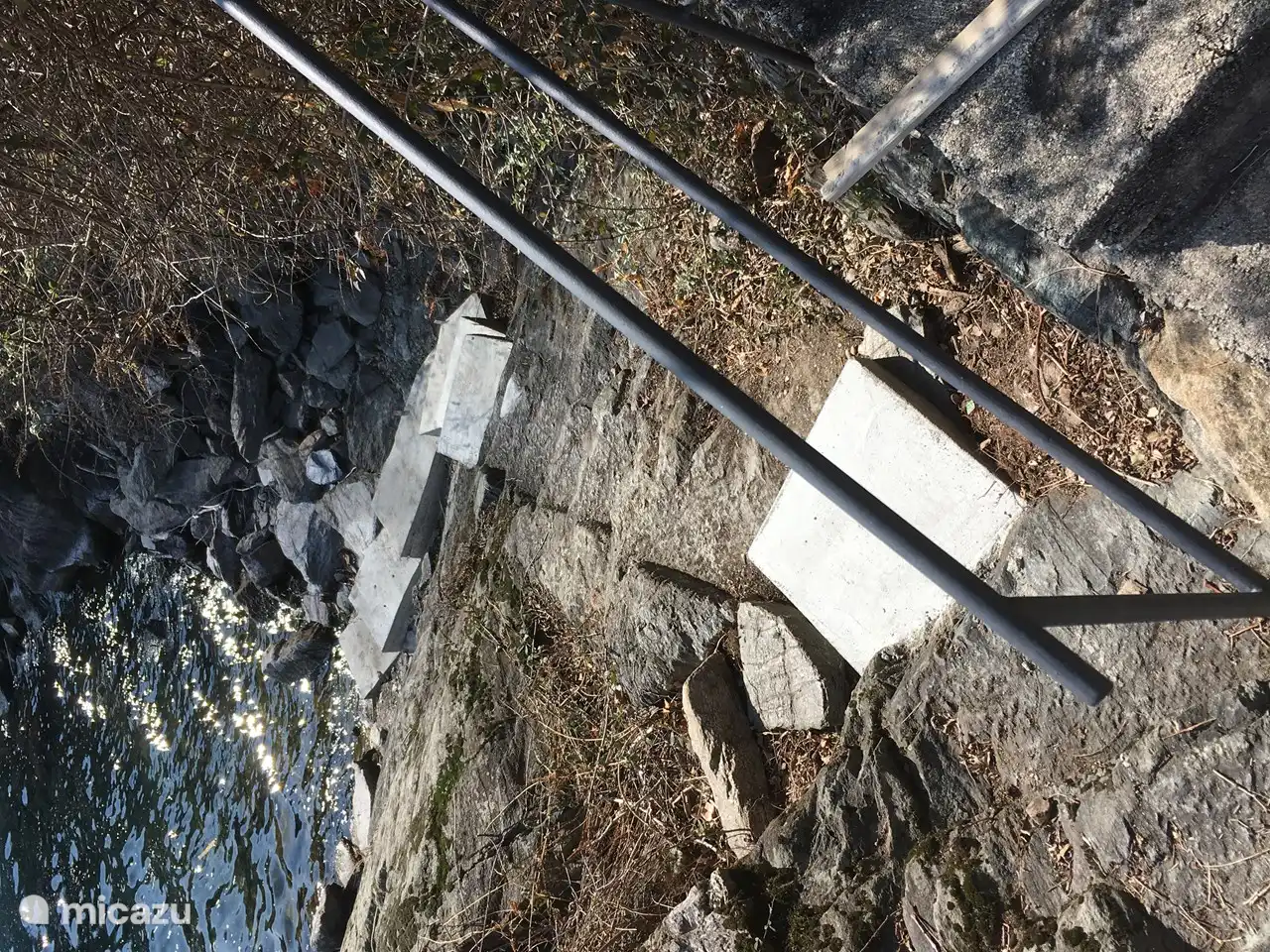 The stairs carved into the rock to the Lago, to which a number of steps have been added.
