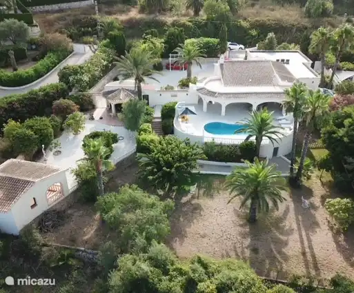 Overview photo of house, swimming pool, garden and annex buildings