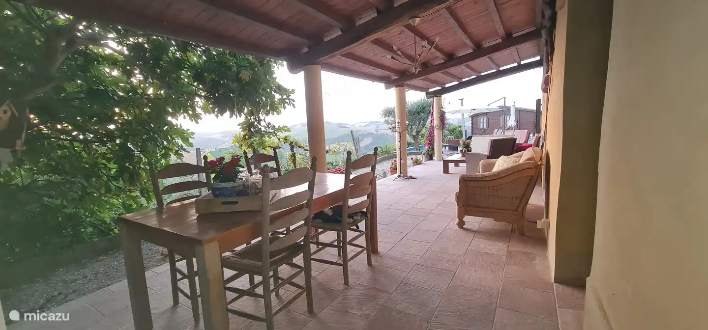 The outdoor dining area is right by the outside door. Nice and easy once you've cooked extensively. You just walk in and out.