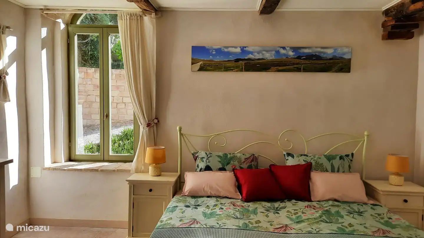 Master bed room. With a self-made photo of Campo Imperatore. You should definitely go again.