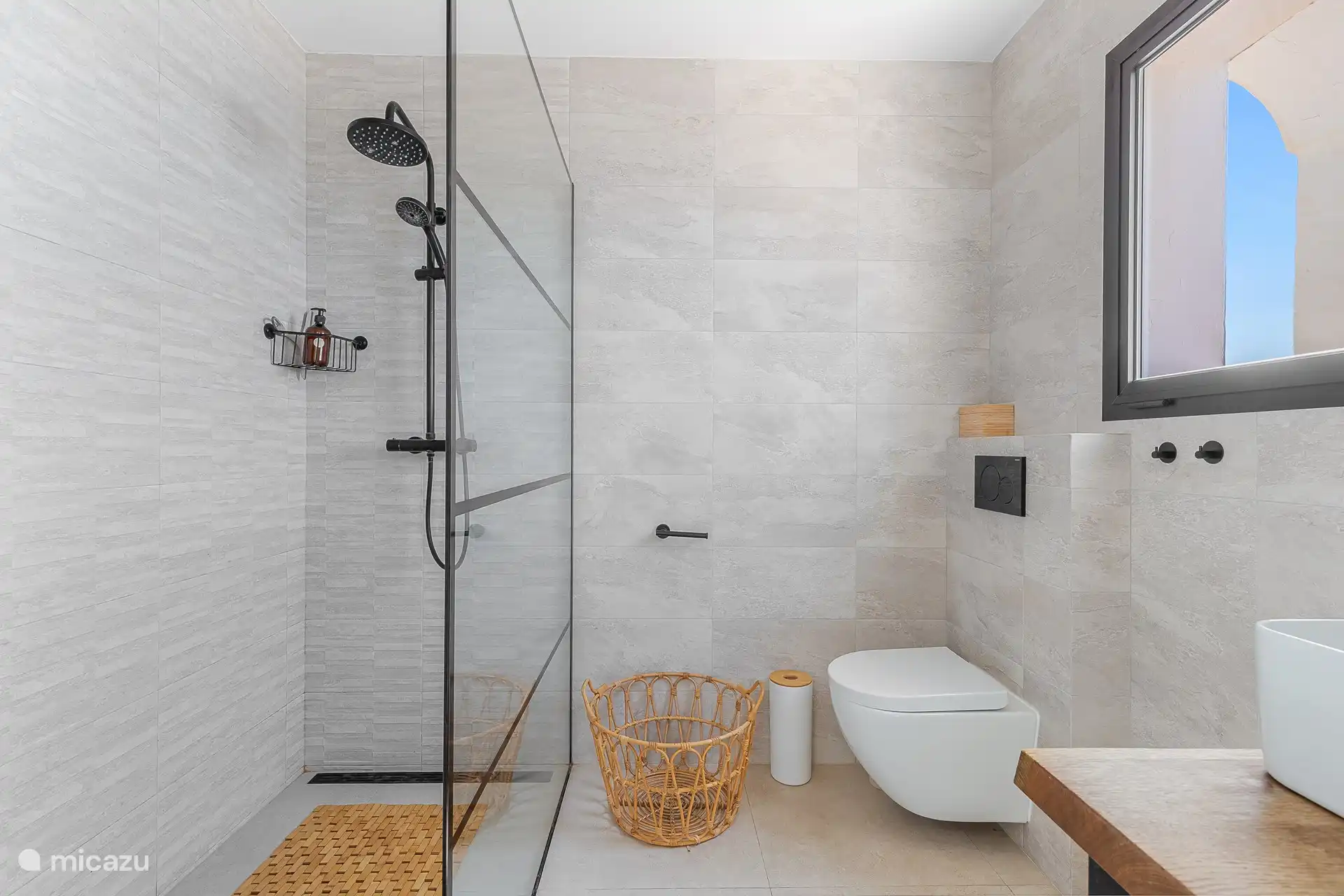 Luxurious ensuite bathroom with breathtaking ocean views, ideal for total relaxation.