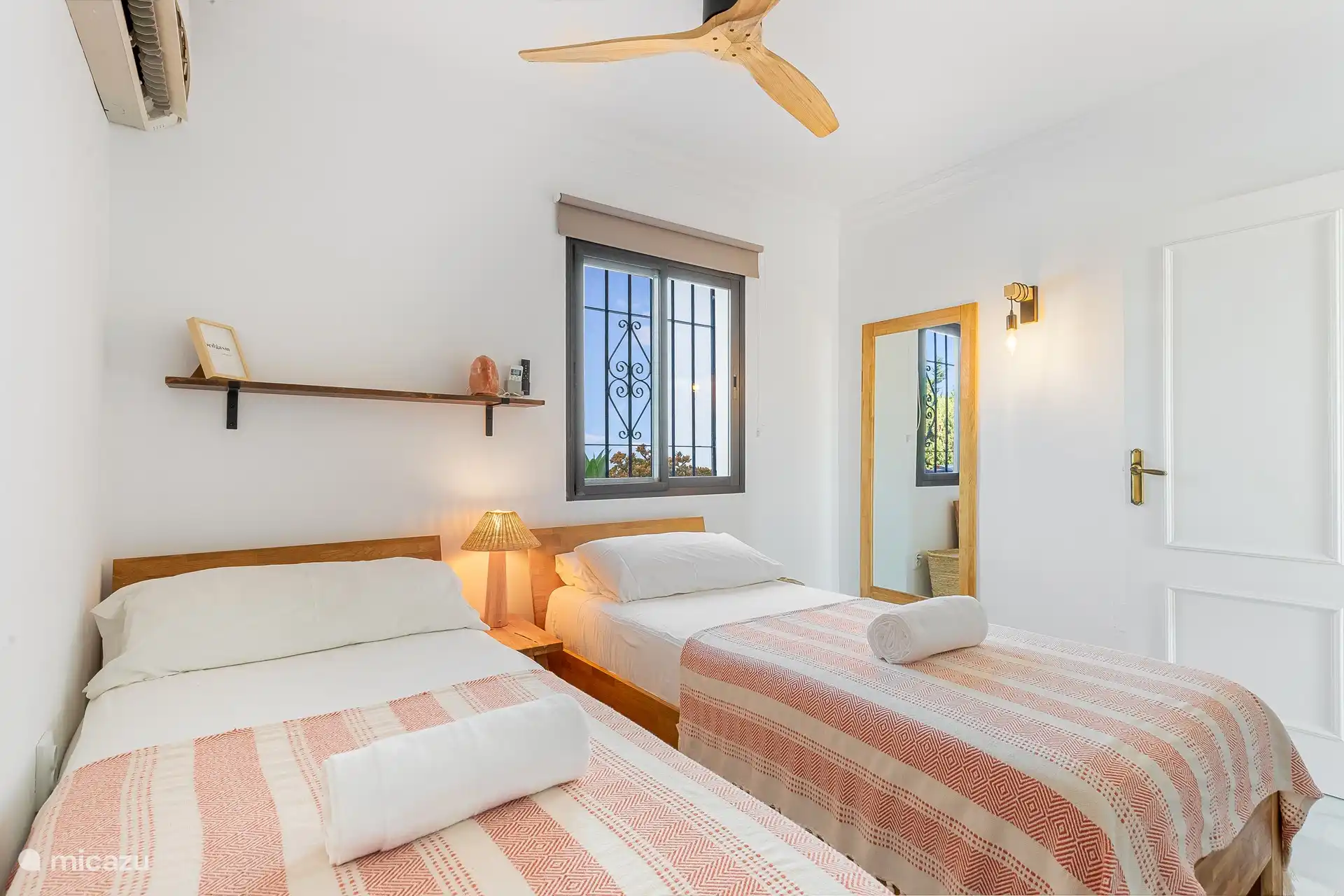 Downstairs bedroom comprising: 1x double bed (180×200) with the possibility to adapt to 2x single bed (90×200)