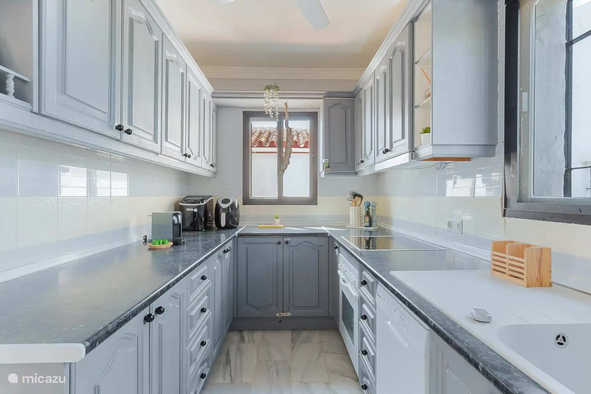 Luxuriously fitted kitchen, fully equipped for all your cooking needs.