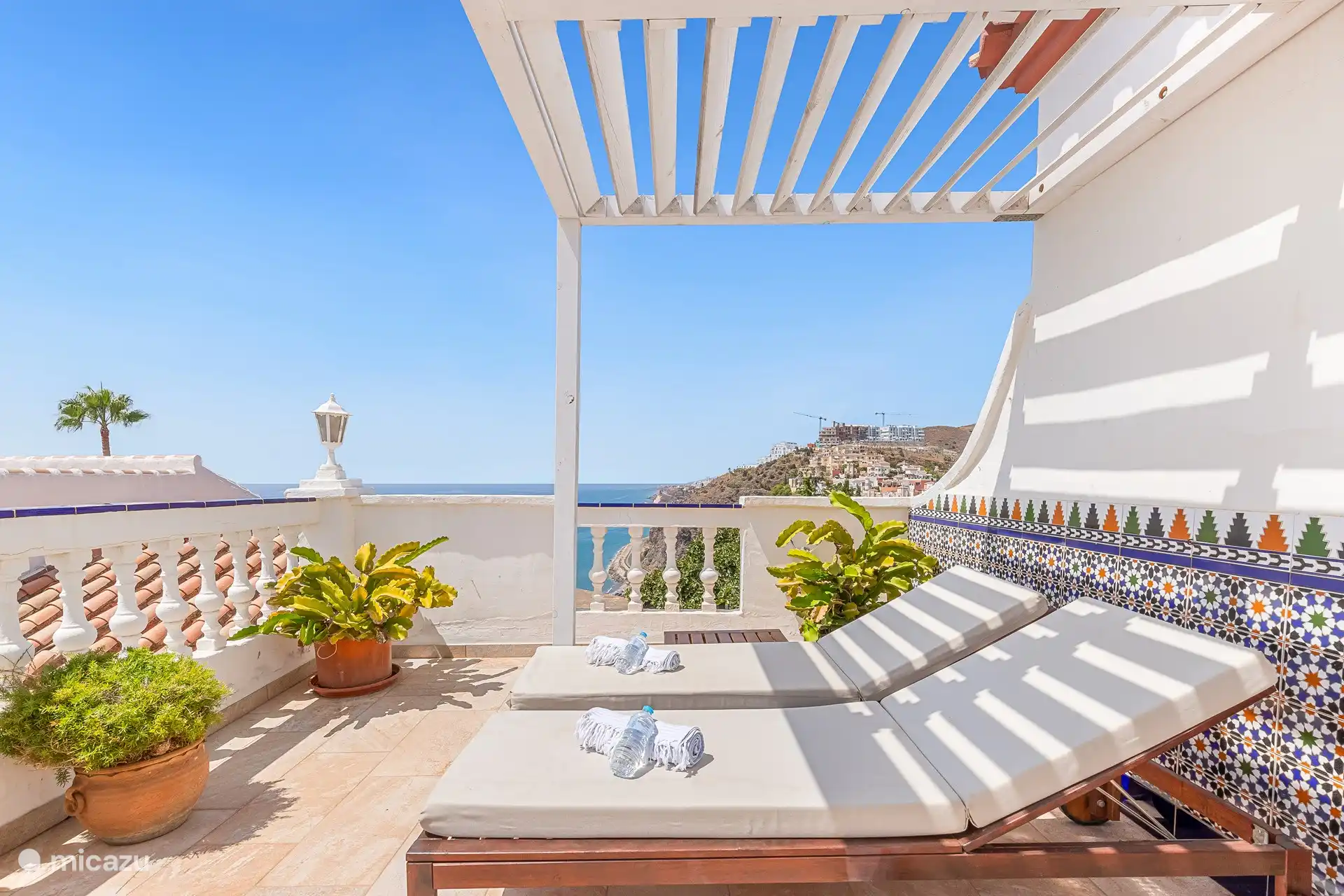 Relaxing under the pergola, perfect for a quiet afternoon.