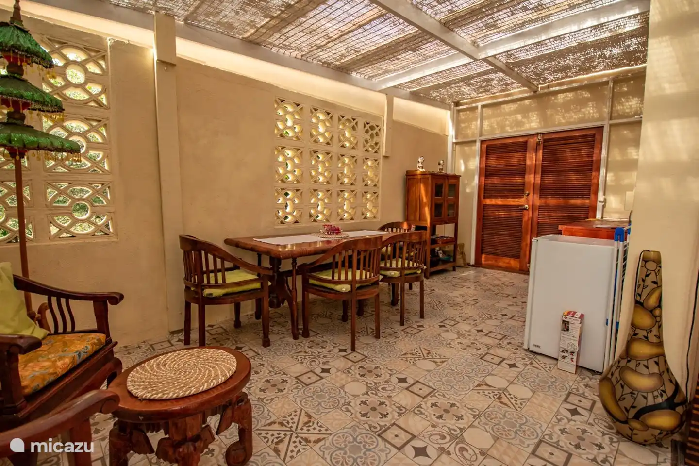 Dining room with part of the kitchen