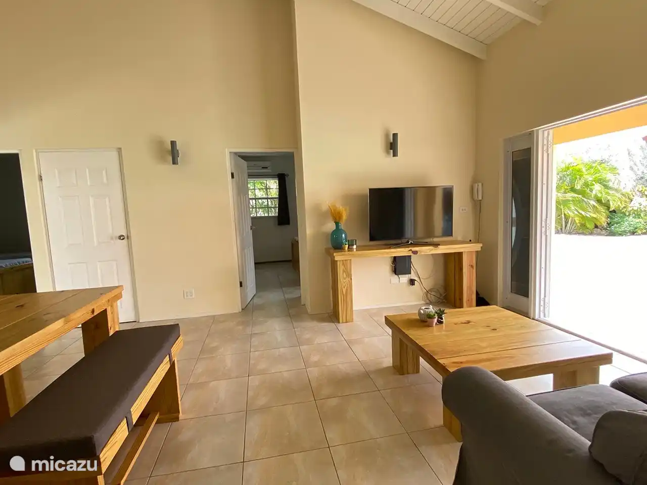 French doors at the front of the house so that the wind can blow through the house to keep it cool