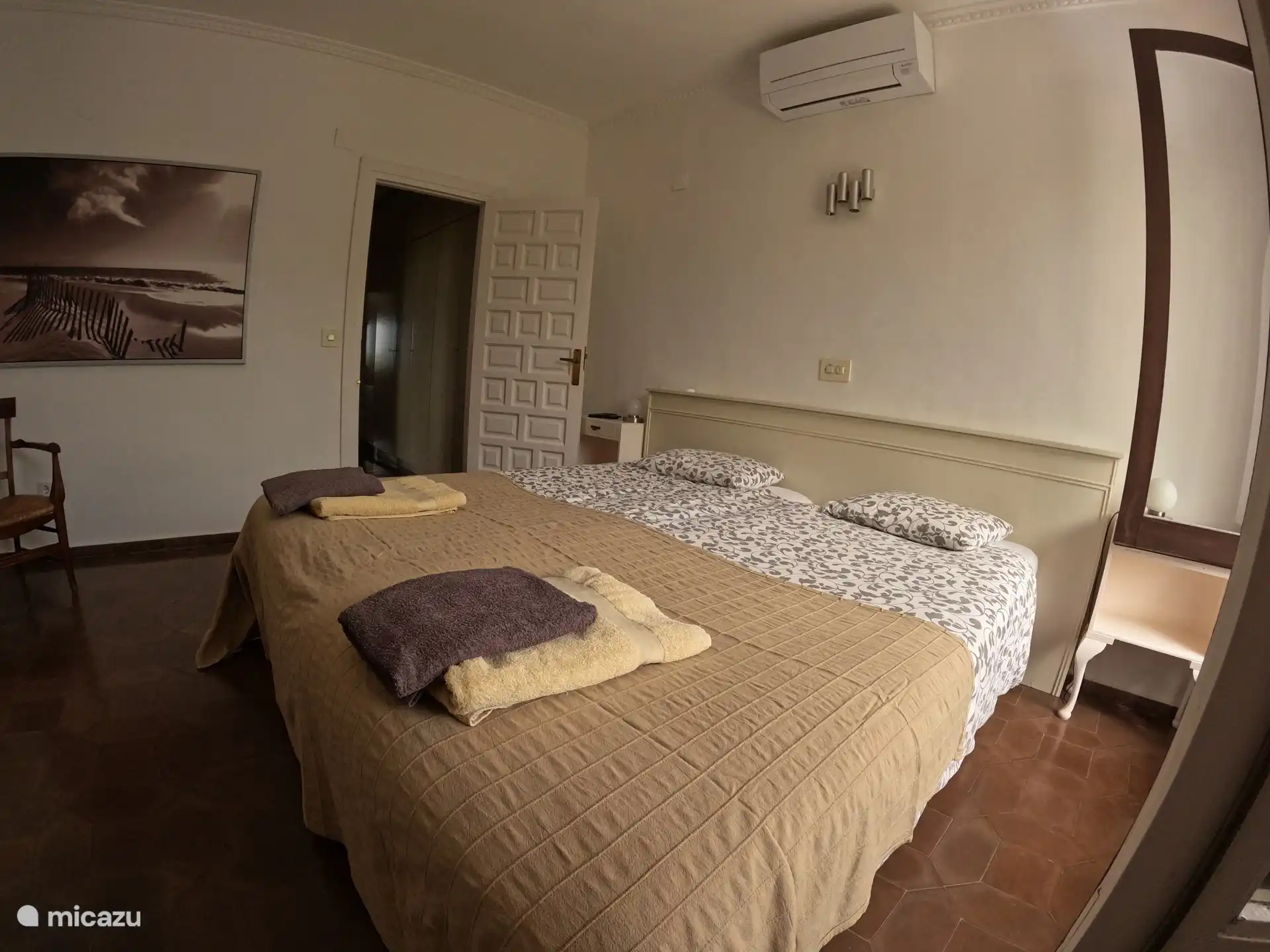 Master bedroom with patio doors to the covered terrace