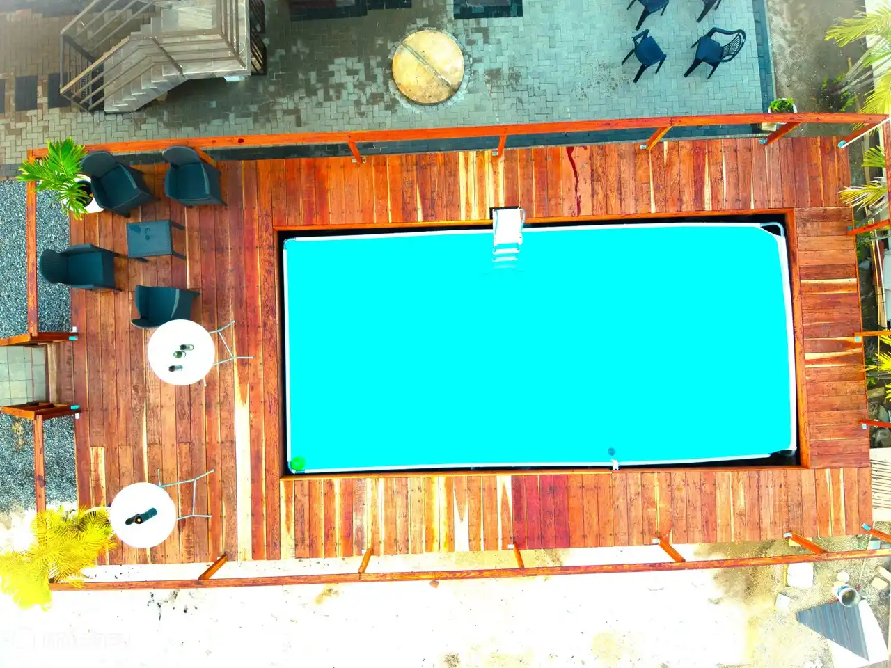Top view swimming pool. Now equipped with turf.