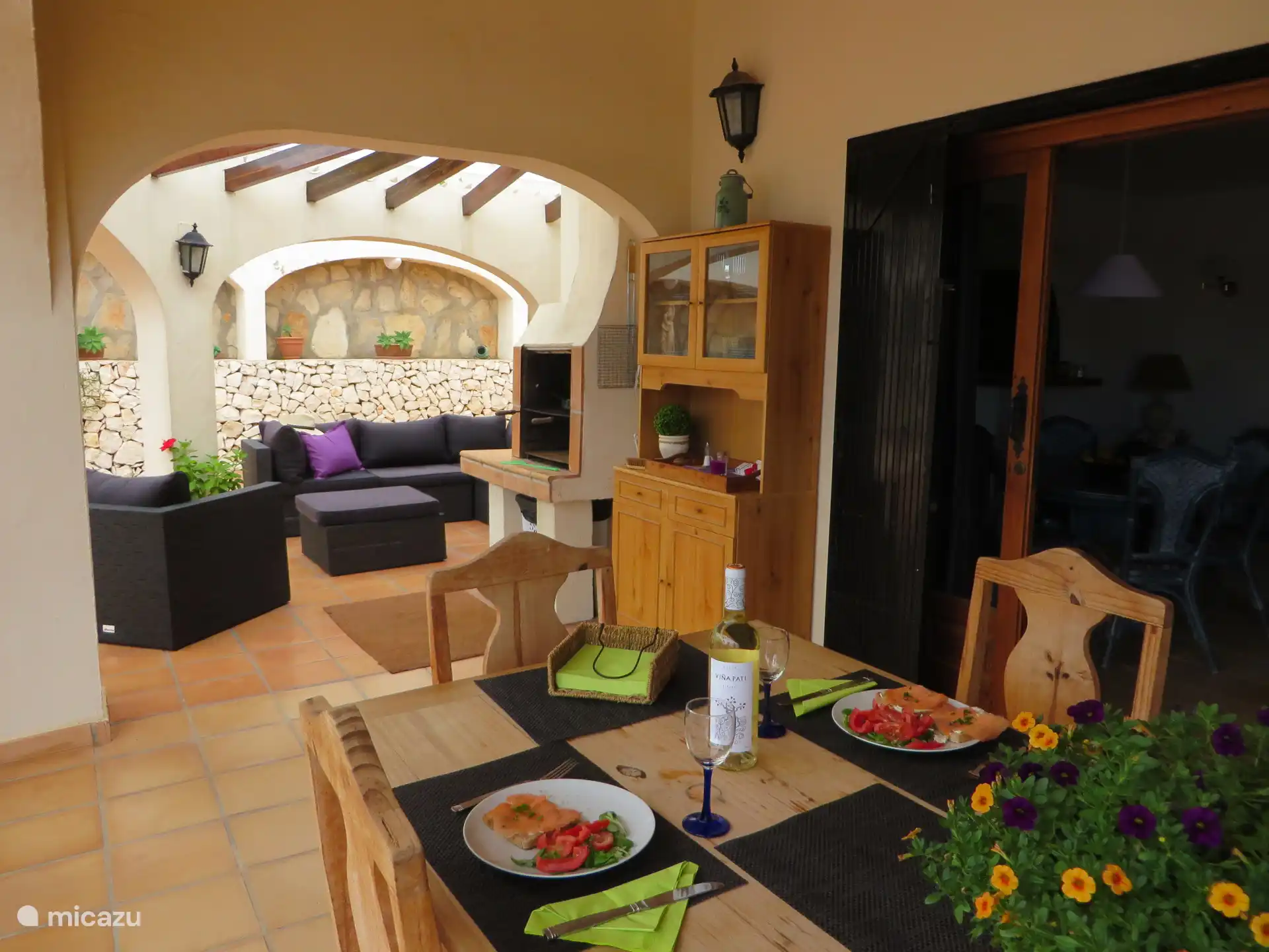 Covered outdoor dining area and lounge area