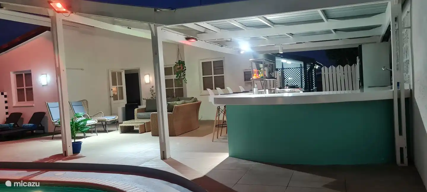 Cozy Backyard with a large pool, bar, grill and patio.