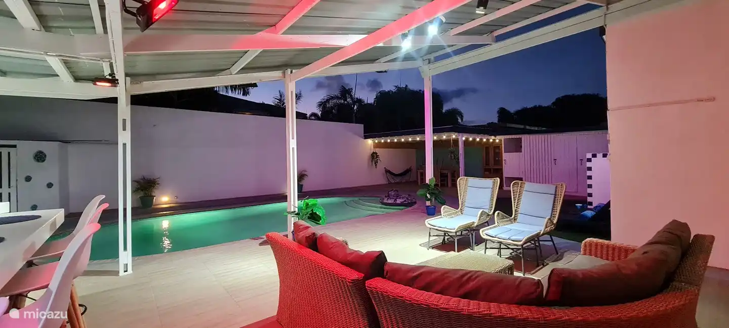 Cozy Backyard with a large pool, bar, grill and patio.