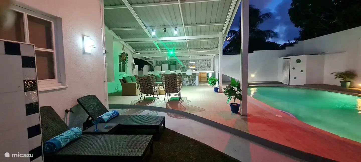 Cozy Backyard with a large pool, bar, grill and patio.