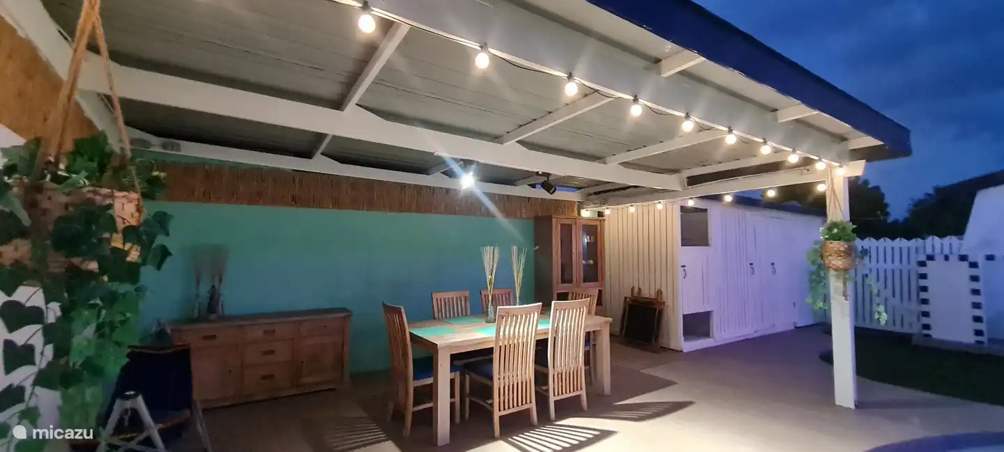 Seating opportunity in the garden with bathrooms in background.