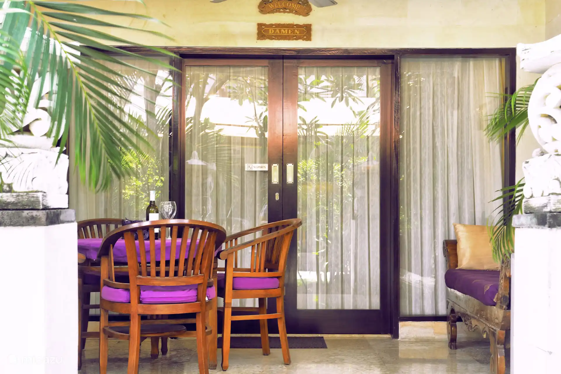 Terrace with table and 4 chairs and a lounge sofa