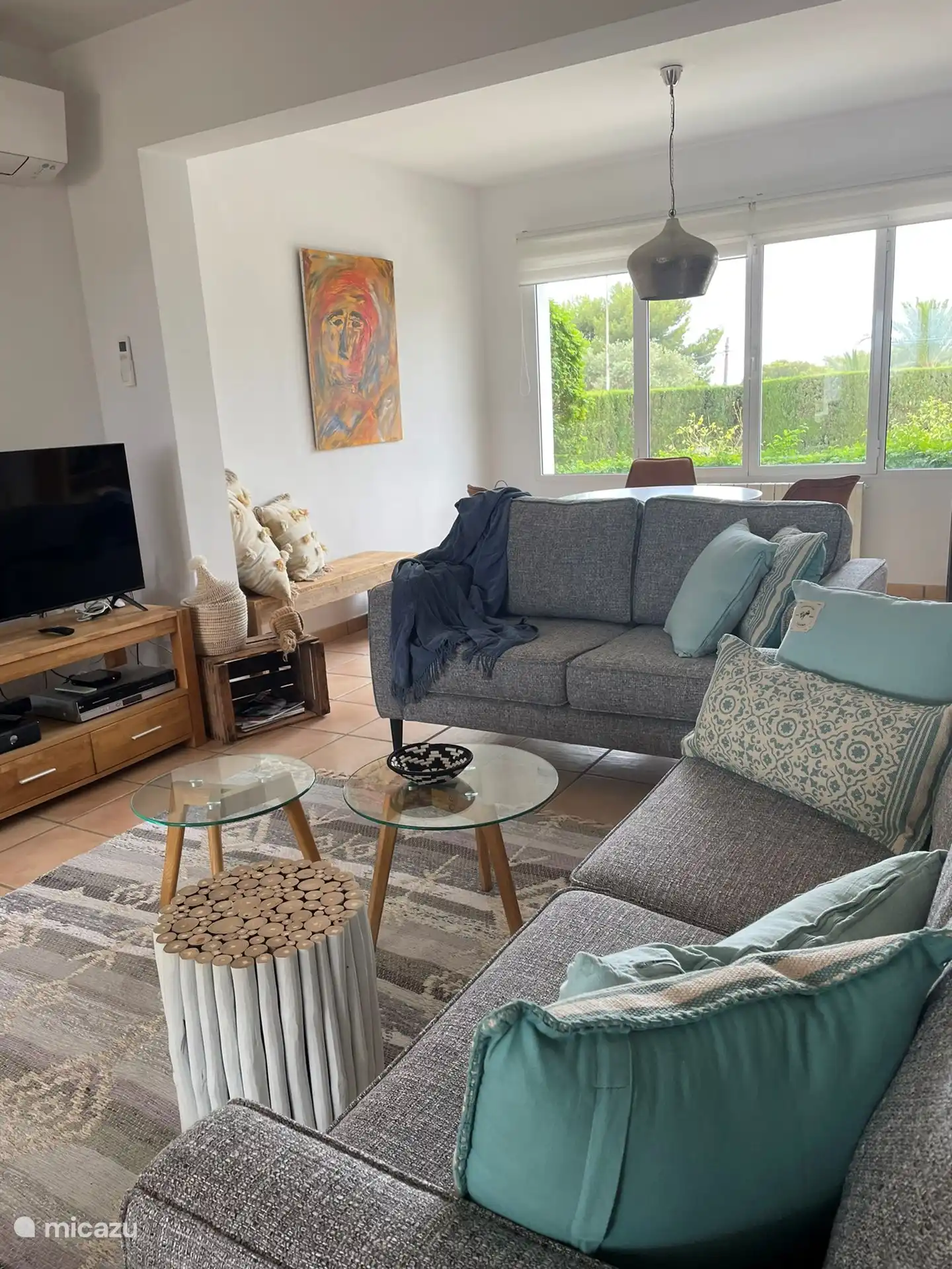 Cozy sitting area, where you can relax. View of the garden and the covered terraces. Ibiza style naya