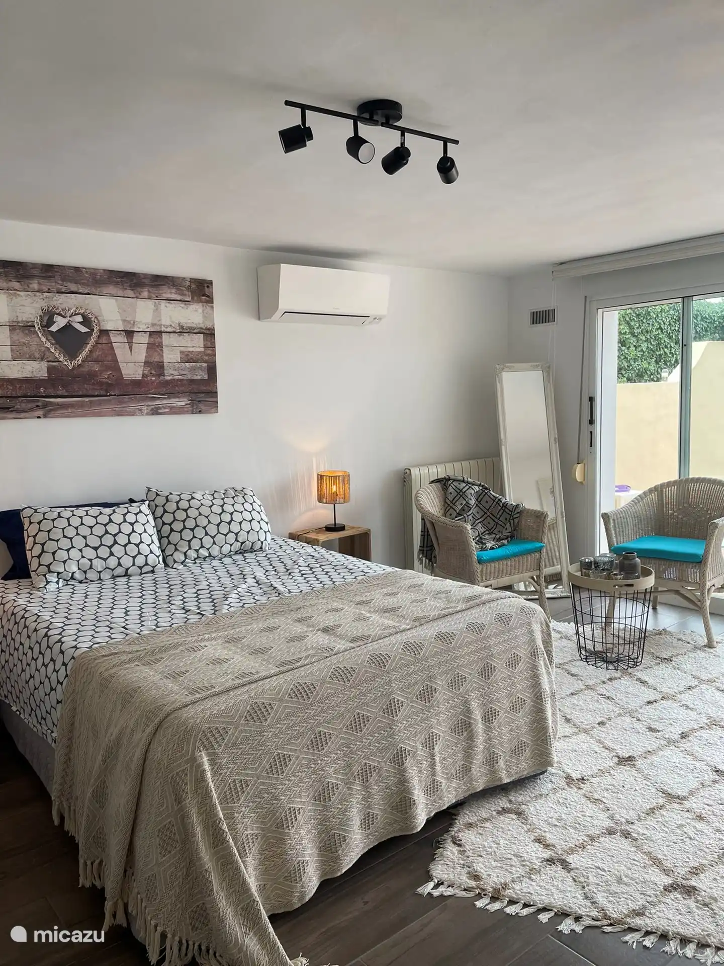 Large room 1 downstairs with a view of the pool.