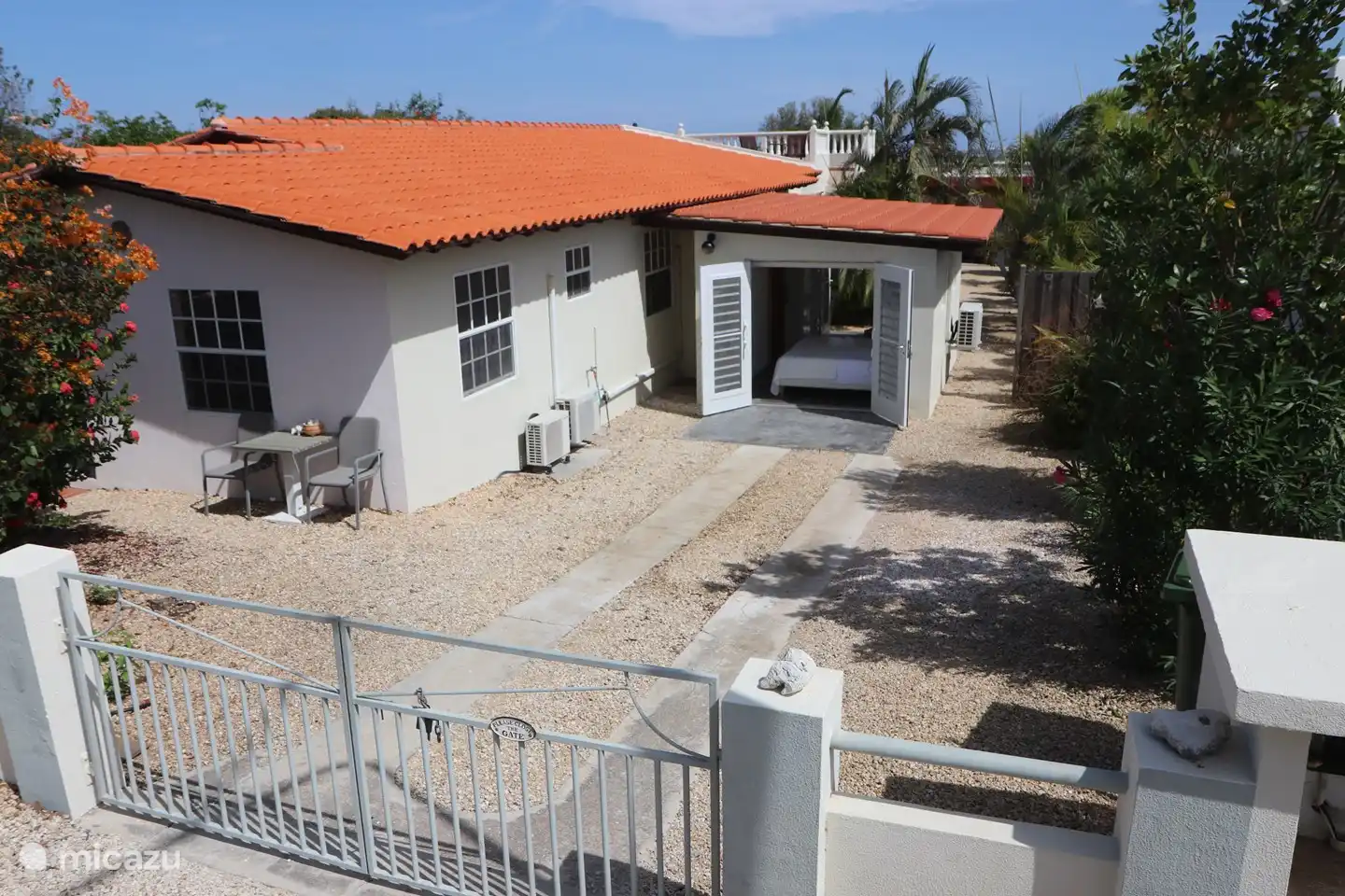View of the front of Blue Miles estate with bedroom and bathroom 2, the sitting area and the garden room. 