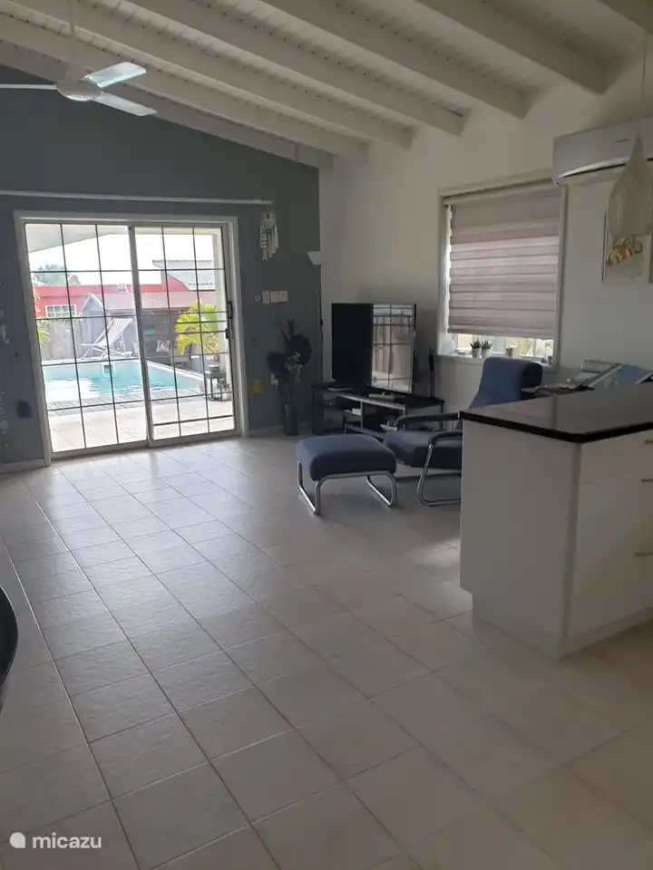 The living room with tiles and relax chairs. Television with many channels. Very good WIFI receives in all places on the property and in the home.